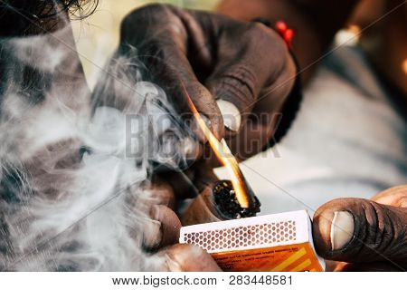 Varanasi India November 19, 2018 View Of A Unknown Sadhu Smoking A Chillum In The Streets Of Varanas