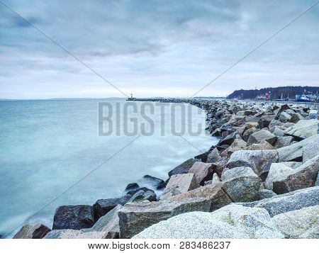 Lighthouse Tower On Stony Concrete Mole In Sasssnitz Town Port, Ruegen Island, Germany. Lighthouse A