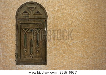 Wooden Window In The Arab Style On The Background Of Textured Wall