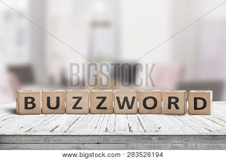 Buzzword Made Of Wooden Blocks On A Table In A Bright Room In Daylight