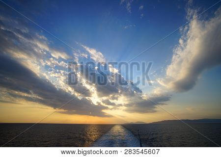 Beautiful Sunset On The Sea Seen From The Ferry On The Route To Mykonos In The Cyclades Islands, Gee