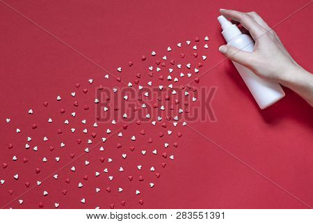 Abstract Red Valentines Day Flat Lay. Top View Card. Womans Hand Is Spraying Little Hearts
