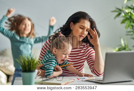 Beautiful woman working on a laptop at home.