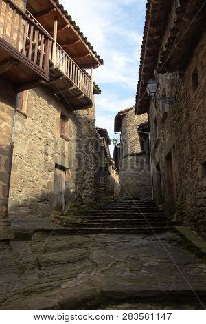 Narrow Street Of The City Of Rupit With Steps Carved Into The Volcanic Rock, Catalonia, Spain