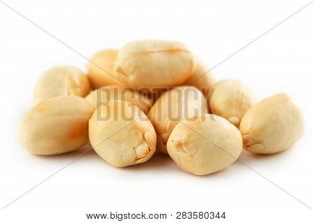 Peanuts Isolated On White Background. Peeled Peel And Scarlup.