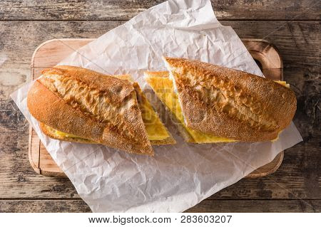 Bocadillo De Tortilla Española. Spanish Potato Omelette Sandwich On Wooden Table. Top View