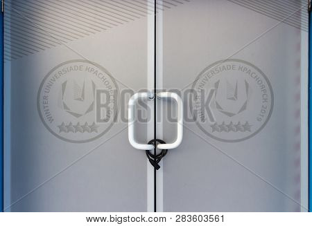 Krasnoyarsk, Russia - 7 January, 2019: Locked Doors With The Logo Of The Xxix Winter Universiade 201