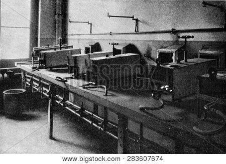 Muffle furnaces in a modern laboratory, vintage engraved illustration. From the Universe and Humanity, 1910.
