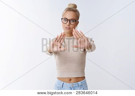 Stay Away From Me. Powerful And Self-assured Serious-looking Young Beautiful Woman In Glasses And Cr