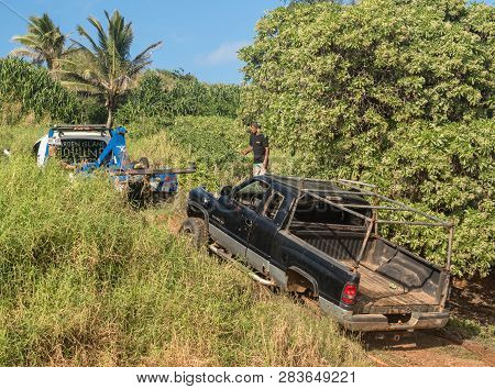 Kapaa, Kauai - January 18, 2019: Abandoned Truck On Beach Being Towed By Garden Island Towing
