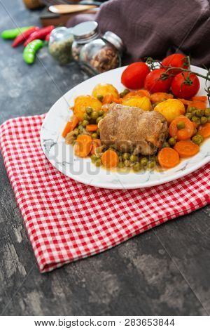 Beef meat stewed with potatoes-Traditional French cuisine Beef Bourguignon potatoes carrots in persillade
