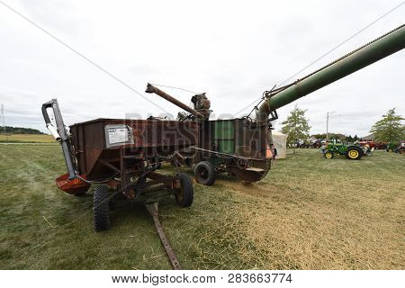 Vintage Farm Machinery Combine Harvester And Wagon On Display At The Bluffton Fall Festival, Bluffto