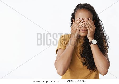 Girl Playing Peekaboo Fooling Around And Having Fun Being Playful Covering Eyes With Palms As Waitin