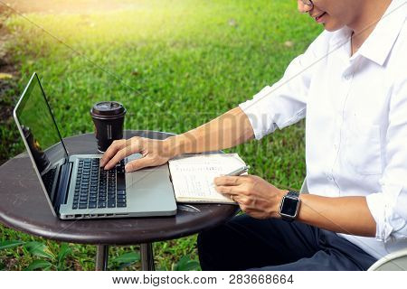 Young Buseness Man Work On The Table With His Laptop