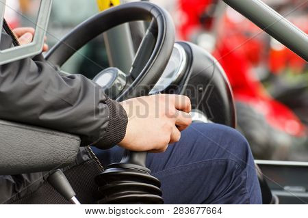 Man Operating Agricultural Or Industrial Machine, Steering Wheel And Control Panel As Part And Detai