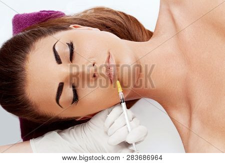 Face Massage. Close-up Of Young Woman Getting Spa Massage Treatment At Beauty Spa Salon.spa Skin And