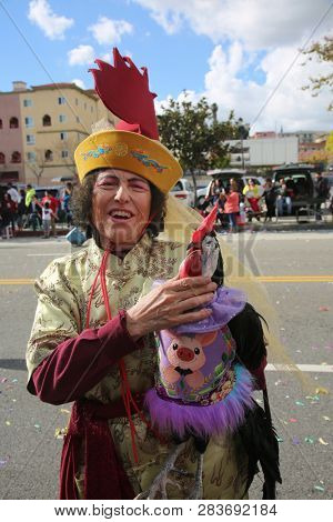 LOS ANGELES - FEBRUARY 9, 2019: Golden Dragon Parade in the streets of China Town Los Angeles. Chico McRooster and his people perform wave and visit with guest at the Chinese New Year celebration.

