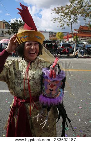 LOS ANGELES - FEBRUARY 9, 2019: Golden Dragon Parade in the streets of China Town Los Angeles. Chico McRooster and his people perform wave and visit with guest at the Chinese New Year celebration.


