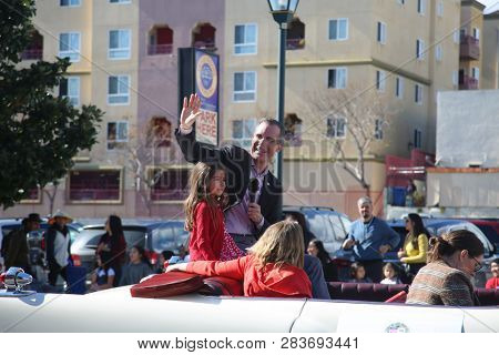 LOS ANGELES - FEBRUARY 9, 2019: Golden Dragon Parade in the streets of China Town Los Angeles. Los Angeles Mayor Eric Garcetti waves to the crown during the Chinese New Year celebration 2019.

