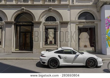 Milan,italy - May 12 2018: Via Monte Napoleone Upscale Shopping Street With Luxury Car. Window Showc