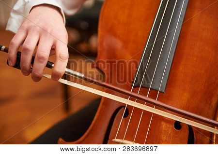 One Cellist Performing A Cello Piece