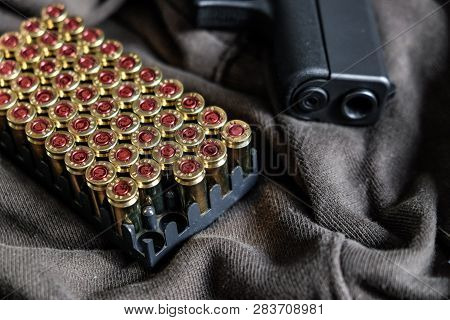 Fmj 9Mm Automatic Pistol Ballistic On Cloth Background