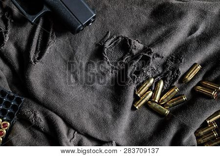 Fmj 9Mm Automatic Pistol Ballistic On Cloth Background