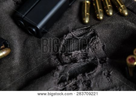 Fmj 9Mm Automatic Pistol Ballistic On Cloth Background