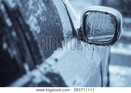 Close Up Shot Of A Frozen Car Mirror After Freezing Rain.