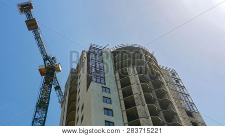 Crane Near Building. Construction Of Office Building  With Two Tower Crane. Construction Site.