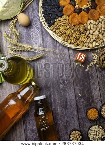 Foods Rich In Vitamin E On Wooden Surface