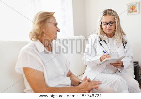 Senior Woman During A Medical Exam With Practitioner