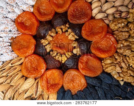 Dried Apricots Raisin And Nuts , Round Composition. Circle Divided Into Parts Made Of A Nuts And Dri