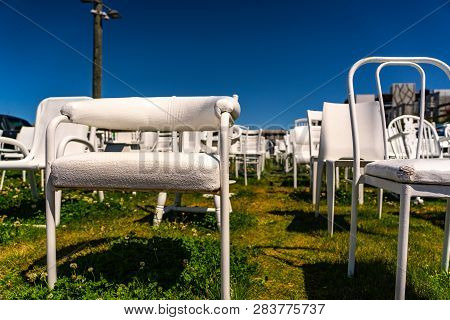 An Installation Of Empty White Chairs Constitutes An Unofficial Temporary Memorial For 185 People Wh
