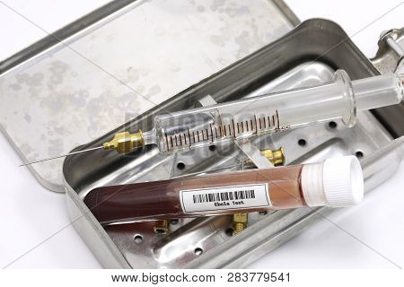 Metal Case With Syringe And Test Tube With Label Bar Code. In The Code Is Wirten Ebola Virus