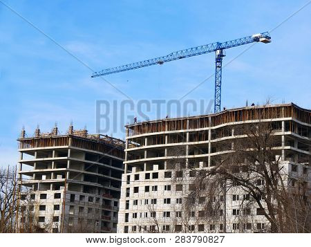 Construction Site Background. Commercial Construction Project. Crane Near Building
