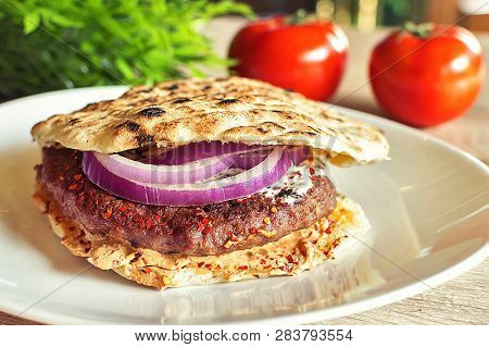Tasty Serbian Hamburger In Pita Bread With Fresh Salad Ingredients