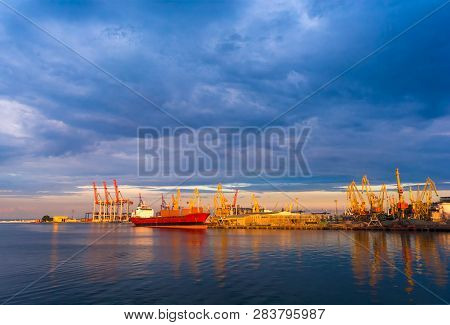 Bulker In Port. Loading On The Ship. Sea. Sunset. Beautiful Clouds. Calm Sea. International Transpor