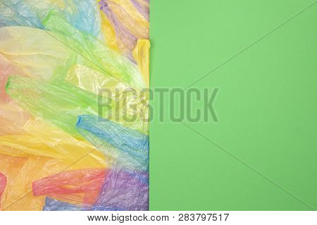 Multicolored Single Use Plastic Shopping Bags With Blank Green Background For Text Or Image