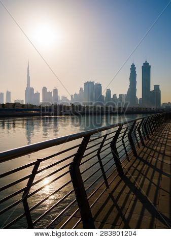 Panorama Of The City Of Dubai Early In The Morning At Sunrise With A Bridge Over The City Channel Du