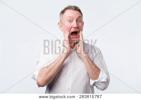 Senior European Man In White Shirt Shout Something
