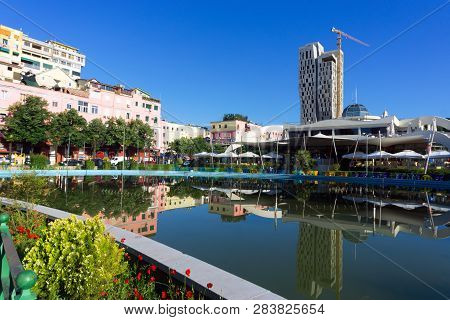 Tirana, Albania- May 12: Reflection Of The Taiwan Center In The Fountain In Rinia Park In Tirana, Al