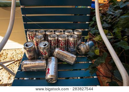 Fairfax, California - February 10, 2019: Empty Coors Light Beer Cans On Outdoor Lounge Chair After B