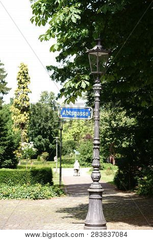 A Nostalgic Street Sign Abbot Street In Mainz On A Striking Lantern.