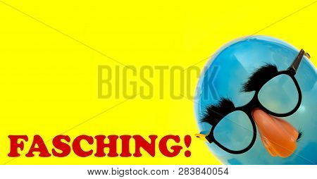 Fasching German Greeting For Carnival - With Blue Ballon With Funny Mask On Yellow Background