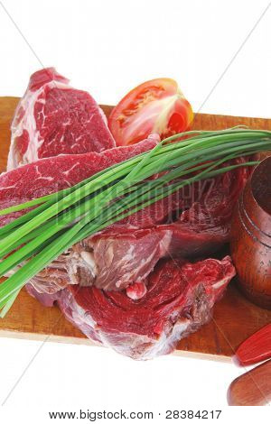 ready to cook: raw beef fillet mignon on cutting board prepared for roasting