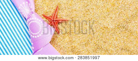 Holiday Gift Card With Violet Bow And Ribbon In The Middle Of Decoration With  Sea Shells On Backgro