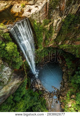 Waterfall Tumbling Over The Sheer Cliffs Into A Rock Pool At The Base Of Its First Big Drop.  Look C