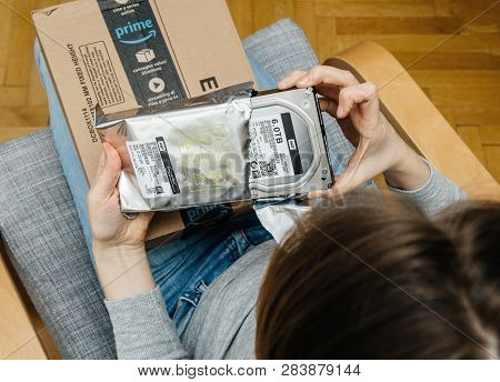 Paris, France - Nov 4, 2017: Woman Pov Unboxing On The Living Room Armchair The Amazon Prime Cardboa