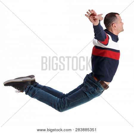 Side view of man in zero gravity or a fall. guy is flying, falling or floating in the air. Side view people collection.   Isolated over white background. The guy in jeans soars in the air or water.